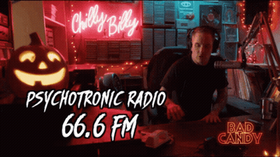 Man Sitting In Front Of Chilly Billy Psychotronic Radio 66.6 FM Neon Sign GIF