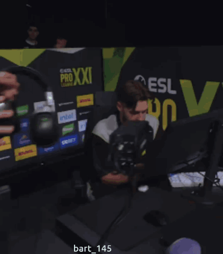 Man Sitting In Front Of Computer With Pro Xxi League Sign GIF