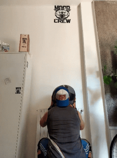 Man Sitting In Front Of Crew Wall GIF