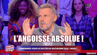 Man Sitting In Front Of Crowd With L'angoisse Absolue GIF