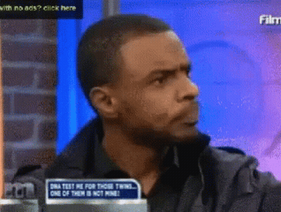 Man Sitting In Front Of DNA Test Sign GIF