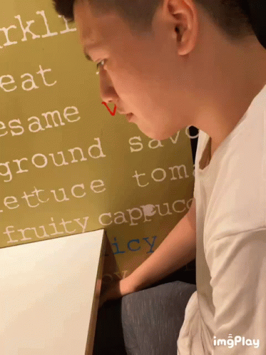 Man Sitting In Front Of Ground Sign GIF