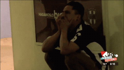 Man Sitting In Front Of Hagamoslo Sign GIF