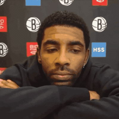 Man Sitting In Front Of HSS Sign GIF