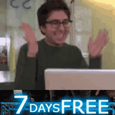 Man Sitting In Front Of Laptop With Hands In Air GIF
