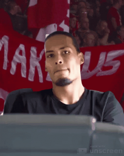 Man Sitting In Front Of Markus Banner GIF