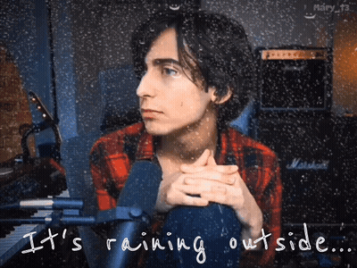 Man Sitting In Front Of Marshall Amp In Rain GIF