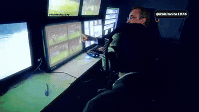 Man Sitting In Front Of Monitors With Robincito 1976 Sticker GIF