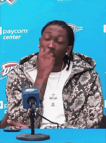 Man Sitting In Front Of Paycom Center Microphone GIF