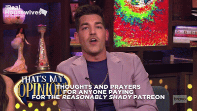 Man Sitting In Front Of Reasonably Shady Patreon Sign GIF