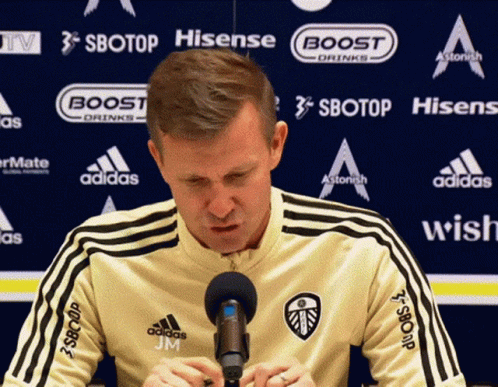 Man Sitting In Front Of Sbotop Banner GIF