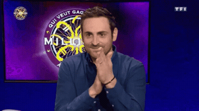 Man Sitting In Front Of Screen Saying Qui Veut Gagner Million GIF
