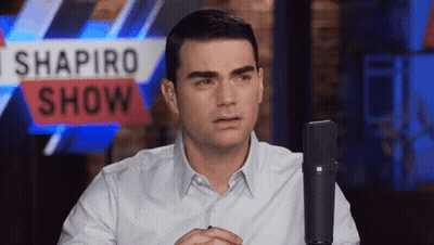 Man Sitting In Front Of Shapiro Show Sign GIF