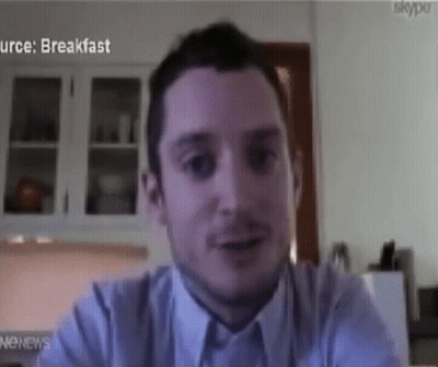 Man Sitting In Front Of Skype Screen GIF