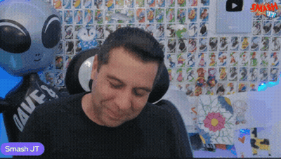 Man Sitting In Front Of Smash JT Balloon GIF