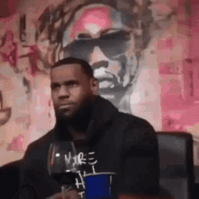 Man Sitting In Front Of Sunglasses Hoodie Painting GIF