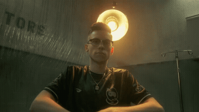 Man Sitting In Front Of Tors Wall GIF