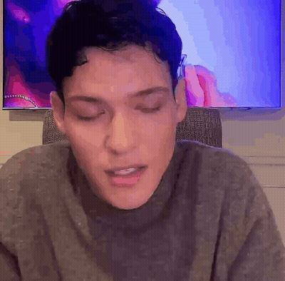 Man Sitting In Front Of TV With Eyes Closed GIF