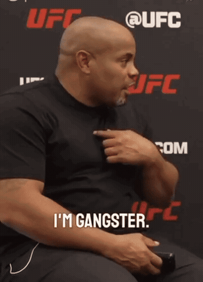 Man Sitting In Front Of UFC Sign GIF