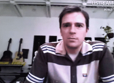 Man Sitting In Front Of Ustream Recorded Live Mobile Screen GIF