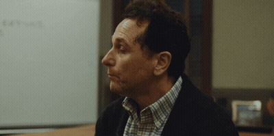 Man Sitting In Front Of Whiteboard Saying Exit GIF