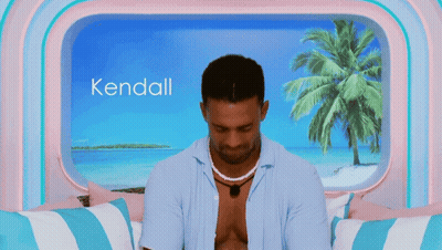Man Sitting In Front Of Window With Name Kendall GIF