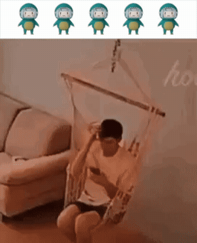 Man Sitting In Hammock Looking At Phone GIF