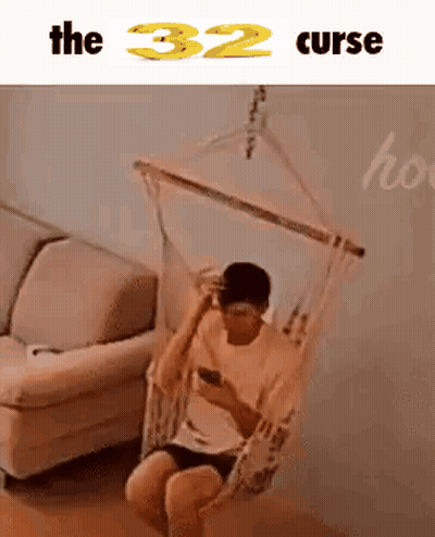 Man Sitting In Hammock Looking At Phone GIF