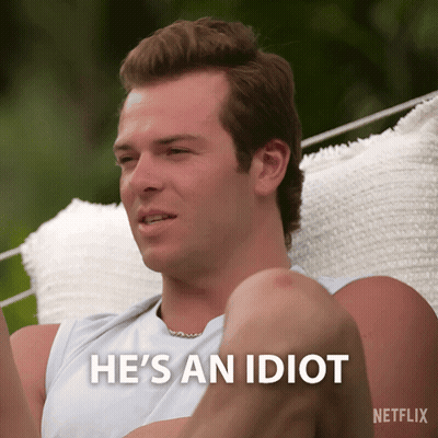 Man Sitting In Hammock Says He's An Idiot GIF