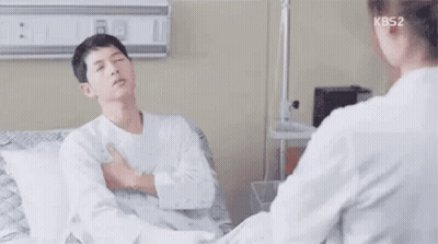 Man Sitting In Hospital Bed Talking To Doctor GIF