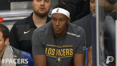Man Sitting In Los Pacers Shirt At Stadium GIF