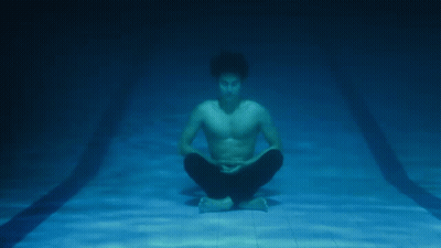 Man Sitting In Lotus Position Underwater GIF