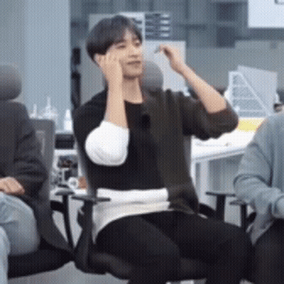 Man Sitting In Office Chair Talking On Phone GIF