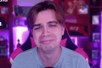 Man Sitting In Pink And Black Chair Sad GIF