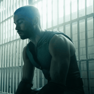 Man Sitting In Prison Cell GIF