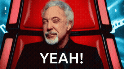 Man Sitting in Red Chair Saying Yeah