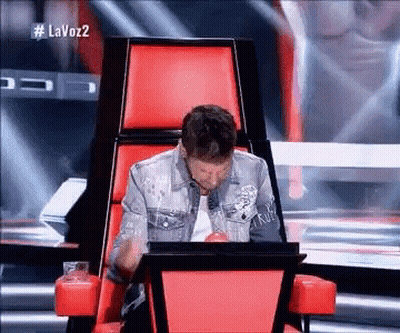 Man Sitting In Red Chair With Laptop GIF