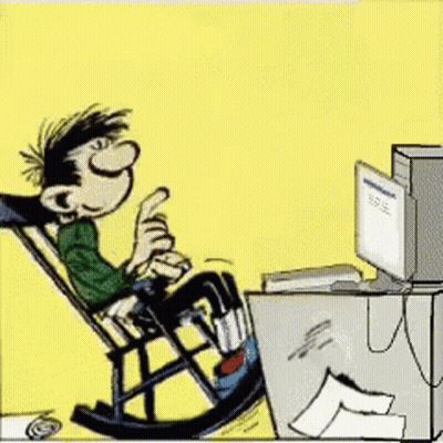 Man Sitting In Rocking Chair Looking At Computer GIF