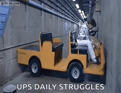 Man Sitting In Small Yellow Truck GIF