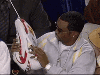 Man Sitting In Stadium Holding Basketball GIF
