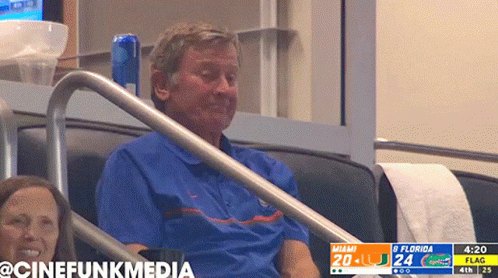 Man Sitting In Stadium Watching Miami Vs Flag Game GIF