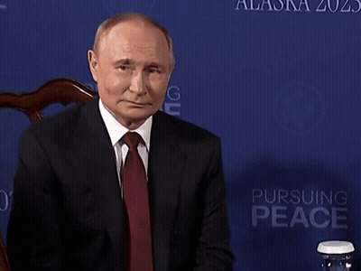 Man Sitting In Suit And Tie Near Blue Wall Alaska 202 GIF