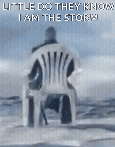 Man Sitting In White Chair Saying Little Do They Know I Am The Storm GIF