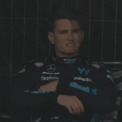 Man Sitting In Williams Racing Jacket GIF