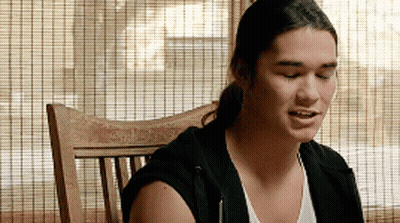 Man Sitting In Wooden Chair With Eyes Closed GIF
