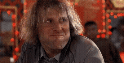 Man Sitting Laughing With Hands On Head GIF