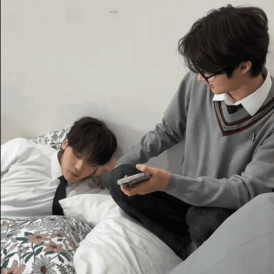 Man Sitting Next To Sleeping Man GIF