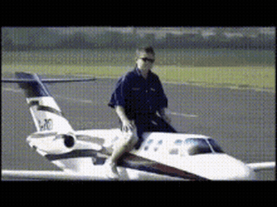 Man Sitting Next To Small Airplane N20 GIF