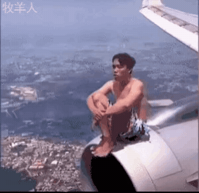 Man Sitting On Airplane Wing GIF