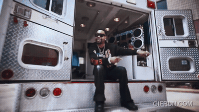 Man Sitting On Back Of Ambulance GIF